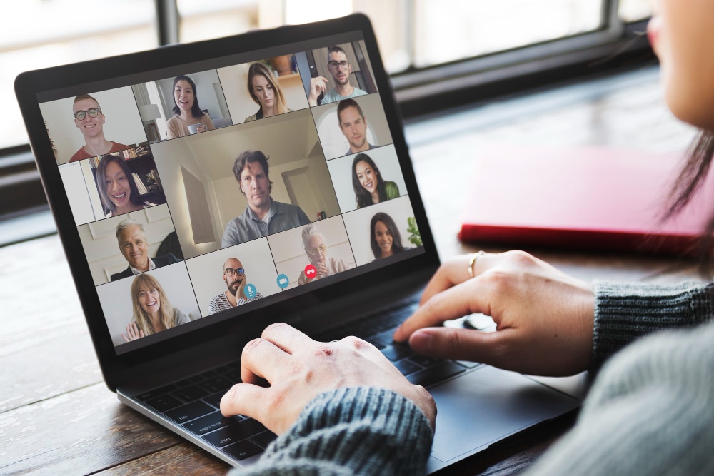 An executive on a video call with an AI note taker transcribing and summarising the meeting on screen