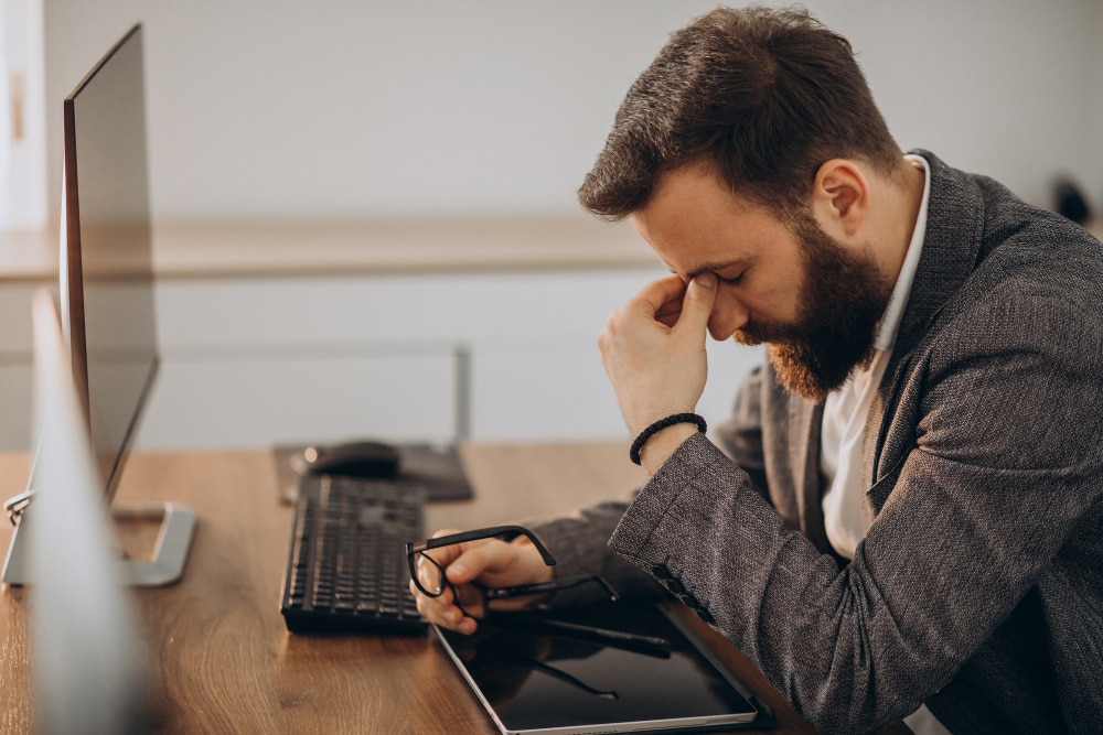 Business leader experiencing the hidden costs and challenges of hiring the wrong executive assistant