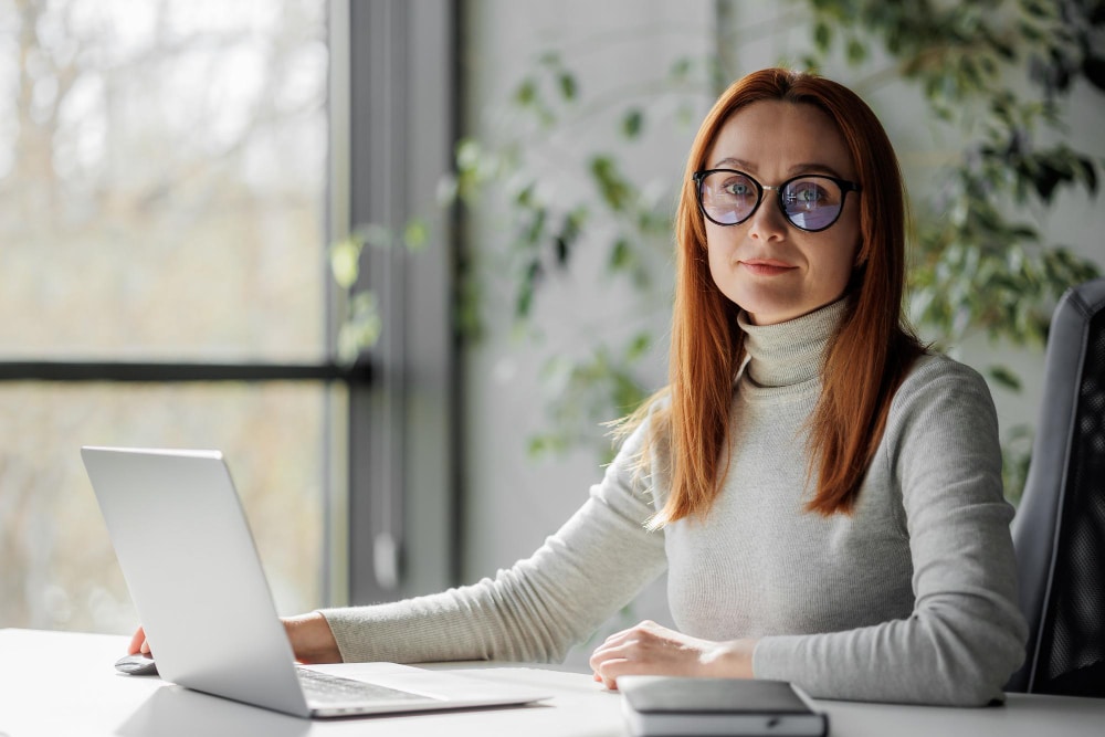 Executive Virtual Assistant working remotely on a laptop