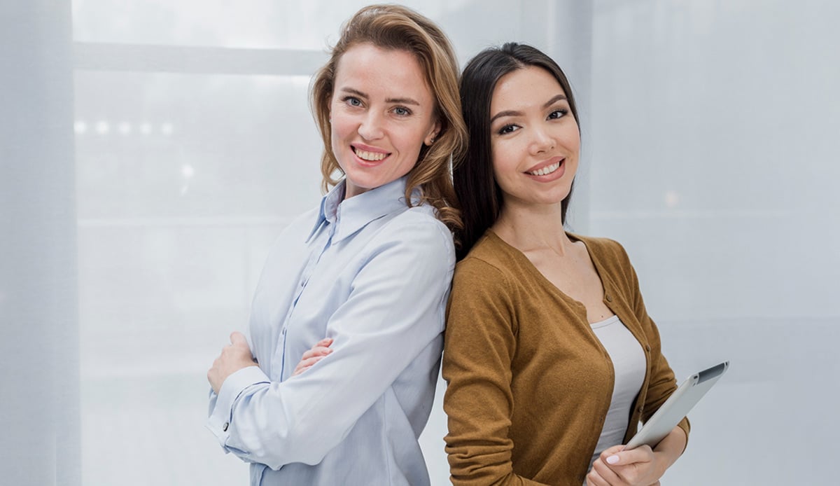 Two assistant standing side by side