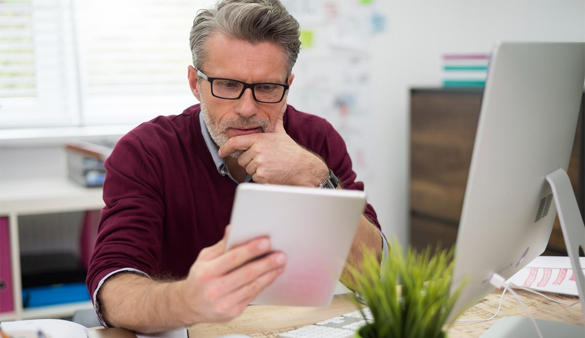 Worried CEO looking at cost in home office