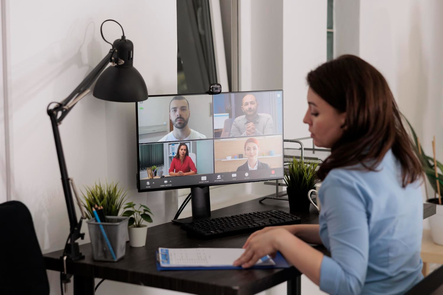 Executive virtual assistant on video call coordinating with CEO client remotely