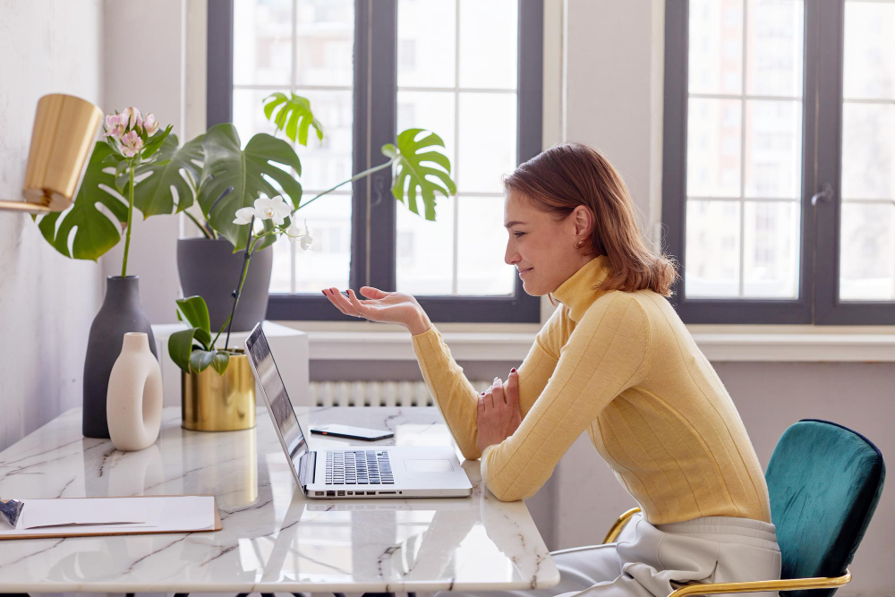 Remote executive assistant home office setup showing professional workspace with ergonomic equipment and clear boundaries