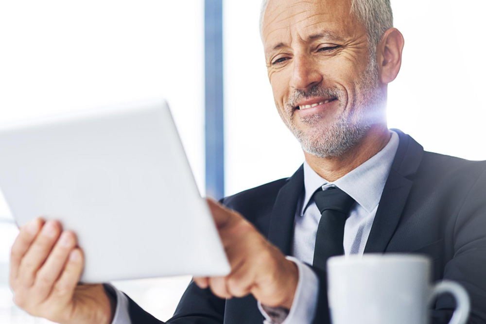 CEO focusing on strategic business decisions while executive assistant handles operational support