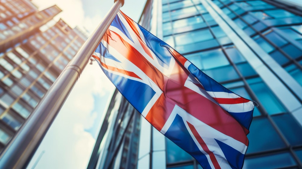 UK flag in front of big building